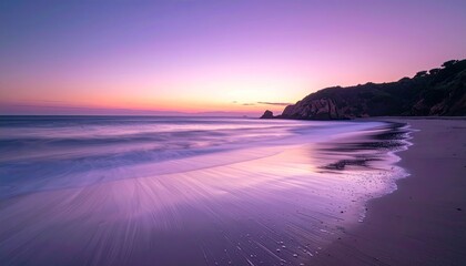 Serene Purple Beach Sunset With Gentle Waves and Rocky Shoreline Under a Soft Dusk Sky