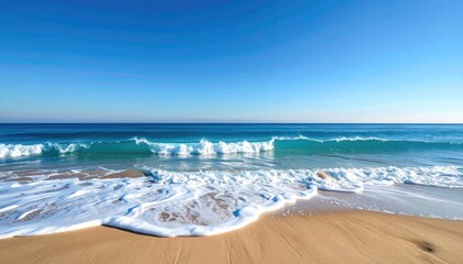 Ocean waves crashing on a sandy beach during a warm sunset with pastel sky and reflections on wet sand