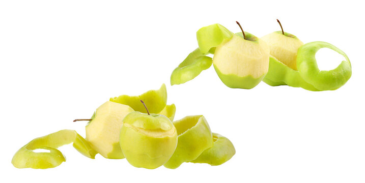 high-quality realistic photograph showing fresh, raw green apples partially peeled with long, coiled spirals of skin removed, isolated on a deep transparent background.