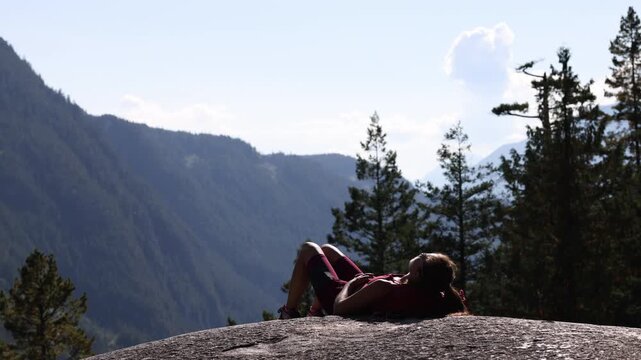 Hiking woman hiker in amazing nature landscape on famous Squamish Stawamus Chief Mountain Hike in British Columbia, Canada. Popular outdoor activity destination in Canada