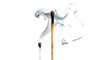 Two matches, one burnt and smoking, against a black background, create a stark, dramatic image