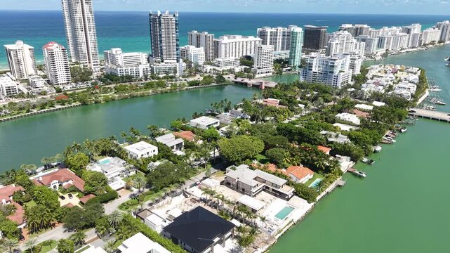 Aerial View of Allison Island and Miami Beach Beachfront Towers, Traffic Around Indian Creek, Drone Shot