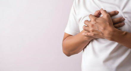 Close-up of person gripping abdominal fat in white T-shirt, Midsection shot highlighting excess stomach skin, Adult torso showing hand grasping waist area, Studio image emphasizing body fat and midrif