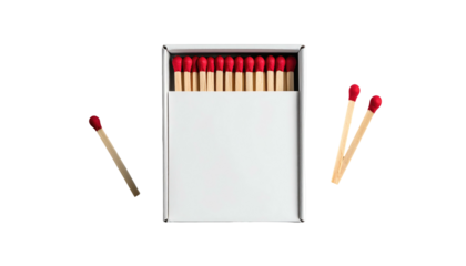 Matches in a box, arranged on a black backdrop with some matches scattered beside