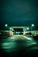 Modern school building on a rainy night in winter. 