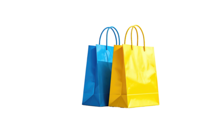 Two vibrant shopping bags, one blue and one yellow, stand against a dark backdrop, lit brightly
