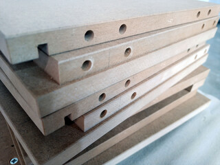 a stack of furniture parts in production. kitchen and cabinet parts