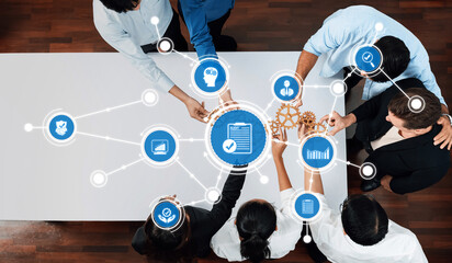 Aerial view of a diverse team collaborating in a business meeting, utilizing technology and innovative tools to enhance communication and drive strategic solutions. Amity