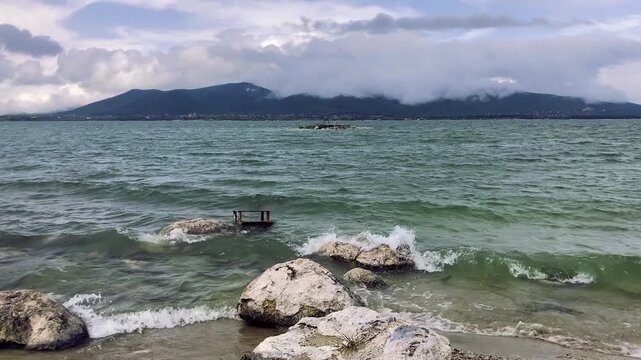 Sevan lake, Armenia. Idyllic scene with mountains and cloudy sky landscape