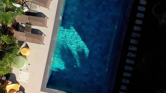 Aerial Drone Footage of a Modern House with Swimming Pool and Garden on a Sunny Day