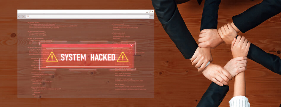 A diverse team of professionals unite around a common goal while reacting to a system hacked alert, showcasing urgency in a collaborative work environment. Trope - Powered by Adobe