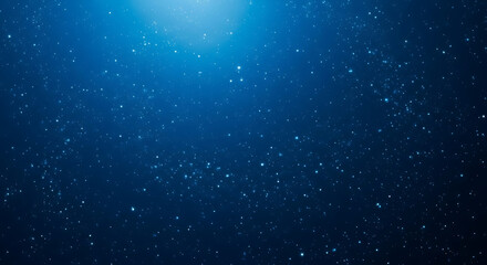 Abstract blue background with glowing particles and light effect