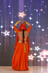 Portrait of an unidentified female artist performing classical dance in ethnic indian clothes.