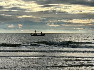 fishing boat at sunset