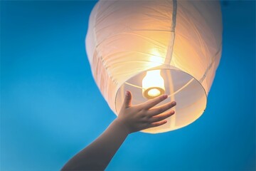 hand lift sky lantern on night sky for festival