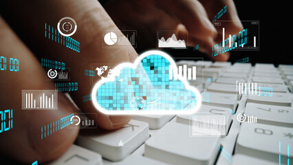 A close-up view of hands typing on a keyboard with cloud computing icons and data graphs overlaid, representing digital technology and modern information management concepts. Xenic
