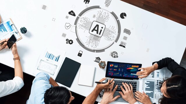 This engaging workspace features professionals collaborating over digital charts and data insights, showcasing artificial intelligence impact on modern business discussions. Raster