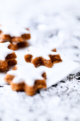 Christmas cookies (cinnamon stars) on bright background. Close up.