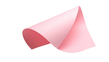 Pink paper sheet curls upward, catching light and shadow against a pure black background