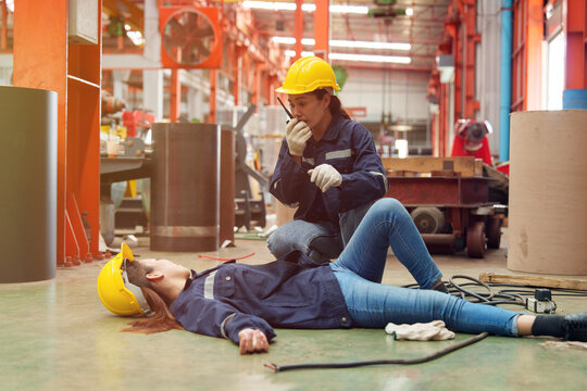 A female employee is helping her friend who was electrocuted in a metal cheese factory.