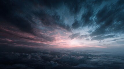 Obraz premium Vast moody sky filled with dramatic clouds swirling at dawn or dusk bathed in soft ethereal light