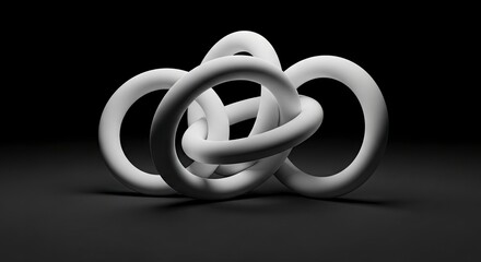 A knot of interconnected white ringshaped forms against a black background