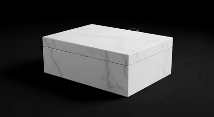 A marblepatterned box with a gold hinge set on a dark background