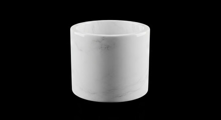 A white cylindrical marble container or holder centered against a stark black background