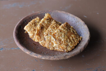 Crispy Fried Tempeh on a Clay Plate