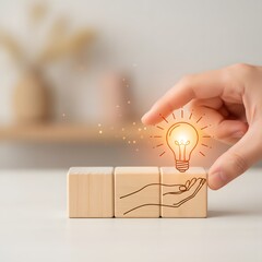 Creative Idea Concept with Hand and Light Bulb on Wooden Blocks