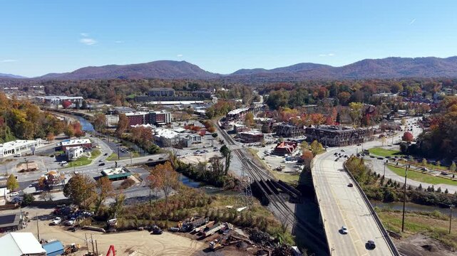 AERIAL RISING UP FROM HURRICANE HELENE DEBRIS IN ASHEVILLE NC, NORTH CAROLINA