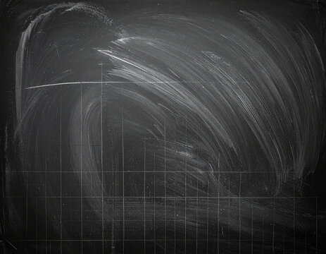 A messy chalkboard with chalk dust and smudges, ready for writing or drawing