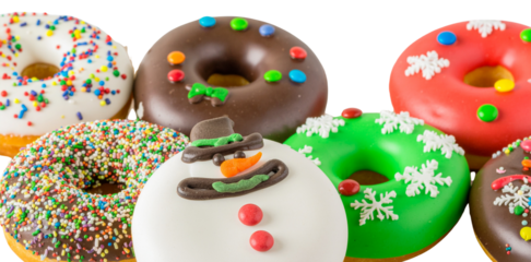 Christmas donut set including snowman, snowflake, and sprinkle designs isolated. Festive food and winter dessert collection.
