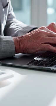 Laptop, hands and typing with calculator at office desk, .accounting and budget planning for company. Update digital record, audit and person with tech for account management, tax return and finances