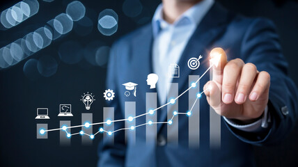 Businessman pointing at a glowing graph with business icons and target symbol