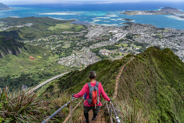 Naklejka premium Haiku Stairs (Stairway To Heaven), Honolulu, Oahu, Hawaii. Koʻolau Range, shield volcano. Kāneʻohe Bay is argest sheltered body of water in the main Hawaiian Islands. This reef-dominated embayment