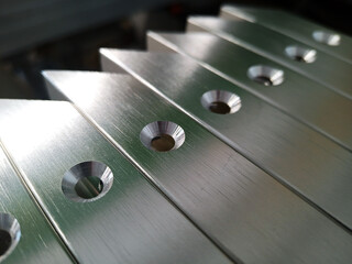 Details of furniture facades with an aluminum frame with countersunk holes. Silver color