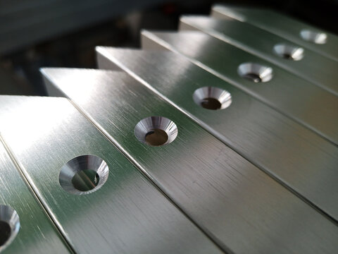 Details of furniture facades with an aluminum frame with countersunk holes. Silver color