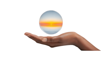 Hand Holding Crystal Ball Reflecting Sunset - Conceptual Image