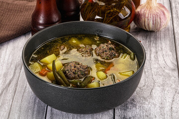 Soup with beef meatballs and vegetables