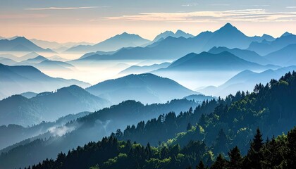 Misty Mountain Range Layers Illuminated by Soft Sunrise Light with Green Forest Foreground in Morning Haze Landscape