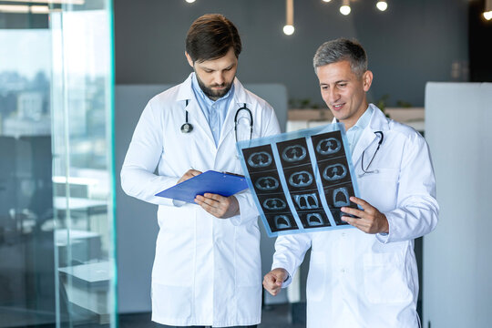 Doctors Analyzing X-Ray Scans in a Hospital Setting