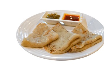 Lempeng (Pancakes) with Red and Green Sambal on White Plate