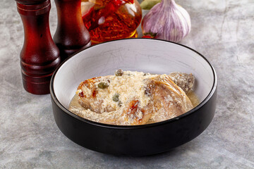 Roasted rabbit legs in cream sauce
