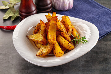 Baked crispy hot potato with rosemary