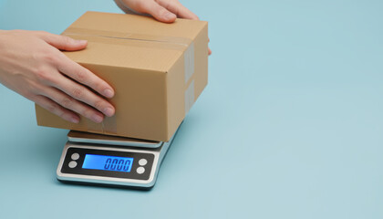 Delivery one person e commerce parcel hands place cardboard box on digital scale