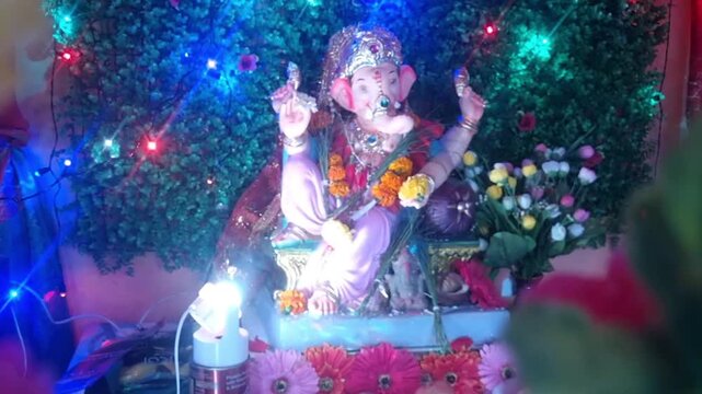 A brightly lit and decorated idol of Lord Ganesha is featured. The Hindu festival of Ganesh Chaturthi, which is particularly popular in Maharashtra and the Konkan region, is being celebrated.