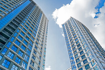 Naklejka premium Architecture Concepts. View of New Construction Site with Civil Building Against Blue Sky.