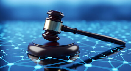 Wooden judge gavel resting on digital network surface symbolizing online law and modern technology regulation concept