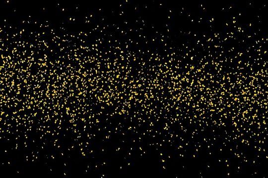 Gold glitter confetti explosion on black background